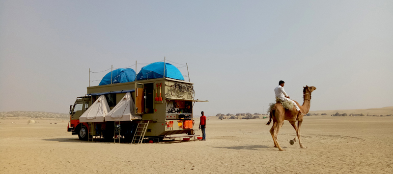 Offbeat private campervan  camping with caravan rv recreational vehicle motorhome sand dunes nomadic holiday for families couples romantic unique lifetime experience outdoor overland truck camp to relax unwind away from touristy crowd at secluded location tanot longewala jaisalmer rajasthan.