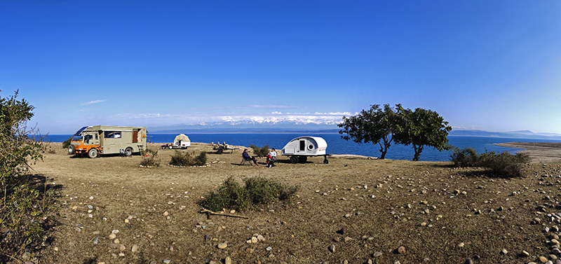 caravan motorhome campervan in wilderness himachal for offbeat outdoor nomadic overlanding camp corona safe holiday social distancing pong dam.