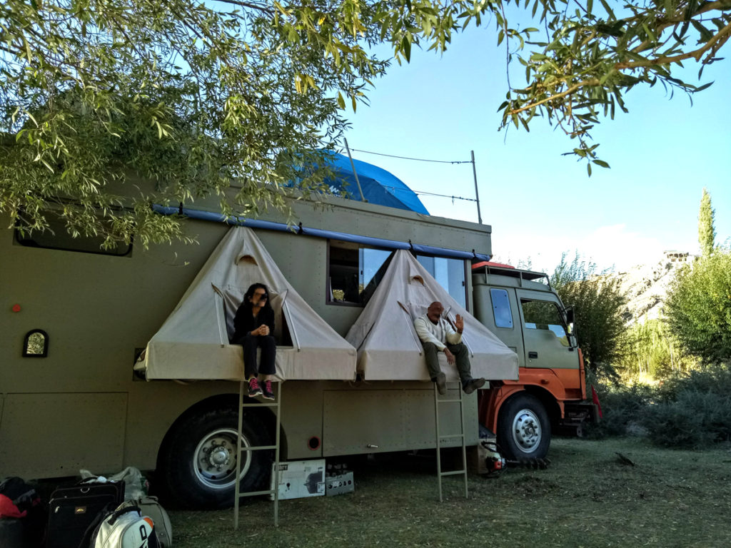 <img src="riverside lakeside offbeat vacation.jpeg" alt="offbeat exotic exclusive corona / covid-19 safe private quiet campervan vacation overlanding overland truck vanlife lakeside camp experience wilderness caravan for best family holiday and couple ladakh">