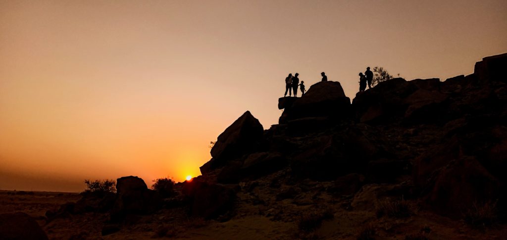 <img src="family holiday sunset.jpeg" alt="caravan camping offers private sunset experience for family in wilderness with comforts near damodra jaisalmer exclusive lifetime experience">    