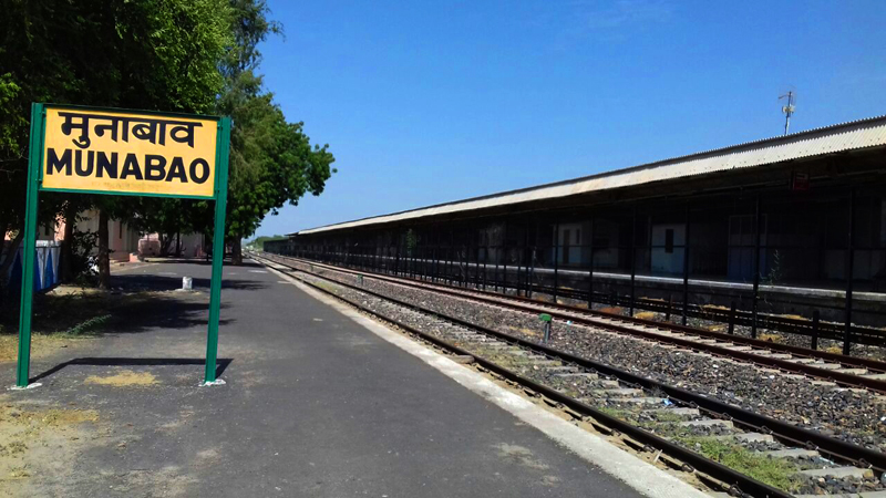 <img src="munabao railway station.jpeg" alt="view of munabao railway station paltform with signboard">       