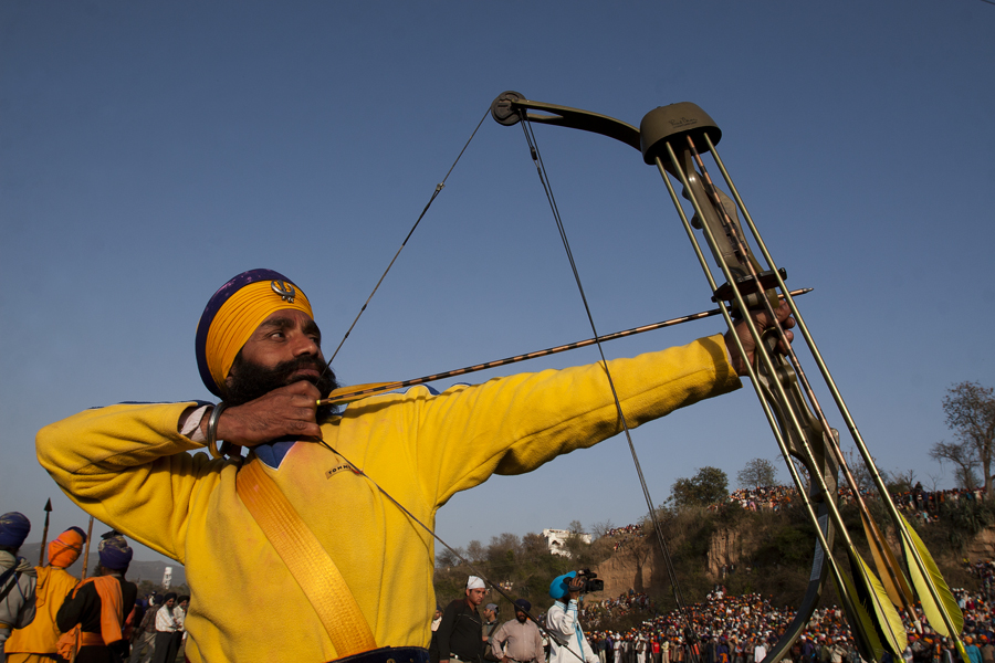 nihang sikh displaying archery at hola mohalla at anandpur sahab in punjab.