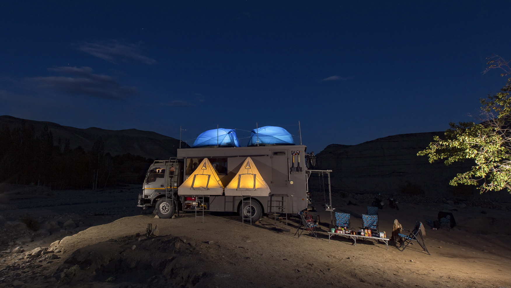 TAURUS IN THE EVENING WITH TENTS LIT UP S Cropped