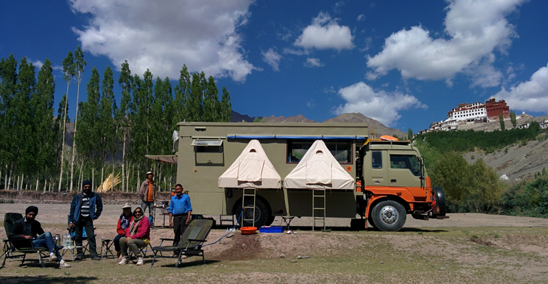 caravan on hire rental in ladakh for offbeat location overlanding riverside campervan camping for photographers families couples at secluded quiet peaceful camp location barbecue hygienic camp matho ladakh.