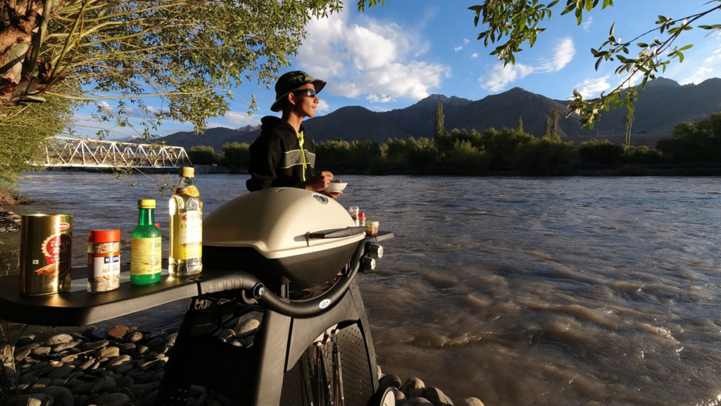 young guest enjoying outdoor family holidays with our campervan caravan vacation in wilderness for orona safe lakeside camp dadasiba pong dam india.