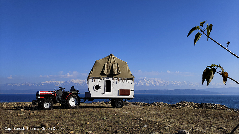 camping trailer and campervan deployed around pong dam in himachal for offbeat camp holiday corona safe with social distancing india. 