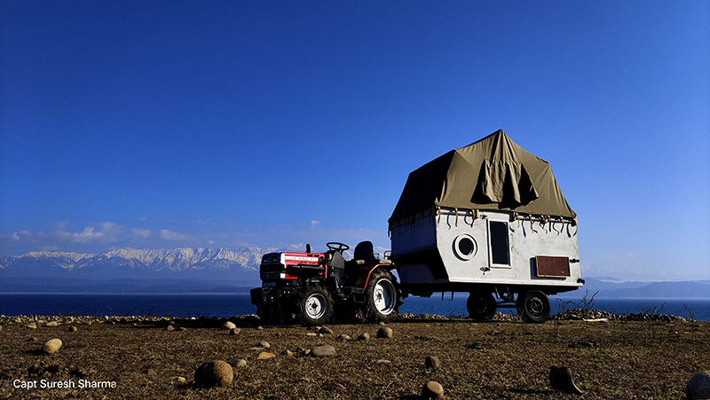 caravan for family vacation and holiday in wilderness with motorhome around pong dam in himachal pradesh.