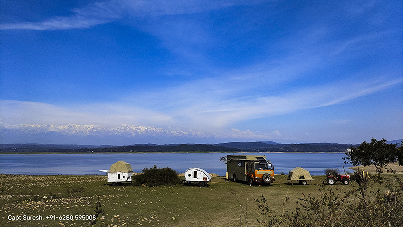 caravan motorhome campervan in wilderness himachal for offbeat outdoor nomadic overlanding camp holiday to relax unwind corona safe social distancing pong dam.