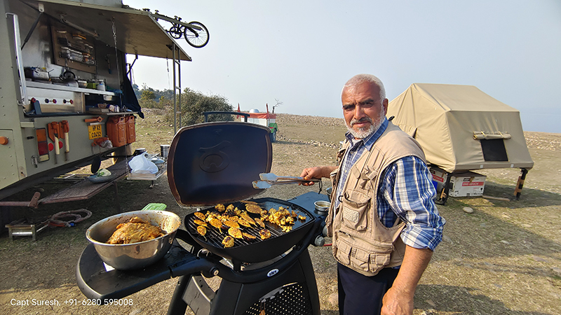 our roving camp deployed for offbeat holidays for senior citizens in wilderness with caravan campervan weber barbecue on the banks of pong dam nomadic unique experience himachal.